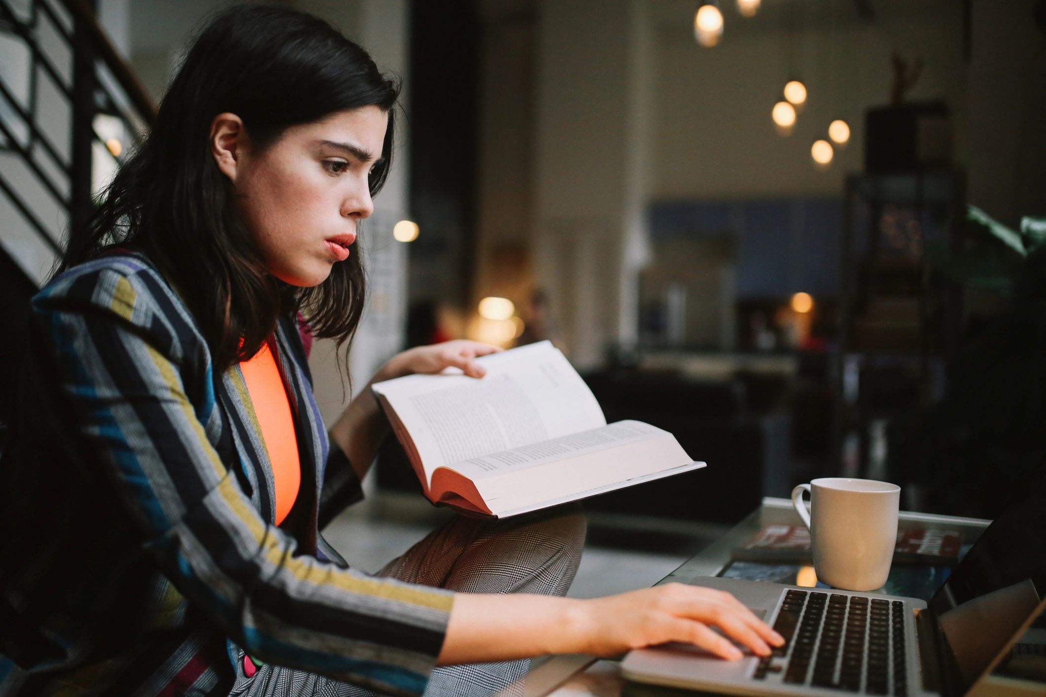 Student reading and studying at a desk