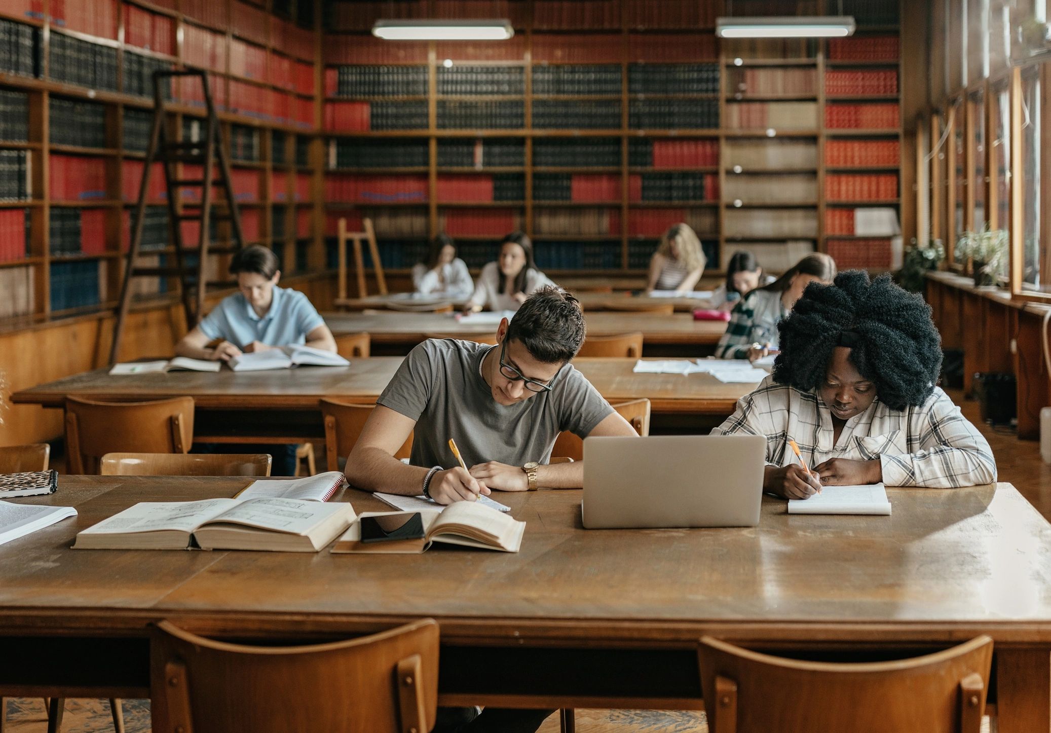 Students studying together in a library